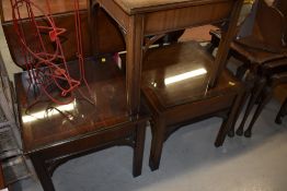 Two modern Regency style mahogany occasional tables, with glass tops, and a similar table with sun