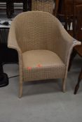 A Lloyd Loom tub chair, bearing original lusty label