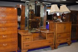A mid 20th Century oak dressing table and side cabinet