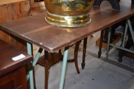 A vintage metal framed folding work table, approx 120cm x 38cm