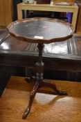A reproduction wine table, leather inset top on triple splay legs, approx. width 33cm height 50cm