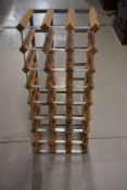 A metal and wood wine rack, 24 bottle , ideal for advent!