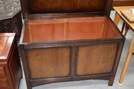 A mid 20th Century oak stile frame blanket box