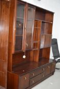 A modern laminate mahogany effect wall unit, width approx. 158cm