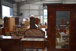 An Edwardian mahogany bedroom suite comprising mirror door wardobe, wash stand, dressing table (back