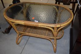 A vintage bamboo and glass coffee table, width approx. 84cm