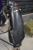 A golf bag and clubs