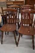 A set of four traditional solid seat kitchen/dining chairs