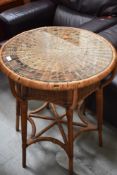 A wicker occasional table/plant stand, diameter approx. 57cm
