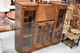 An early 20th Century golden oak side by side bureau display cabinet