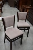 A pair of vintage stained frame/upholstered dining chairs