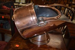 A copper coal helmet, approx. length 40cm