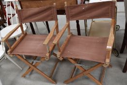 A pair of folding canvas directors style chairs, probably teak frames, could so with a good oil (see