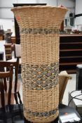 A tall basket of fabrics