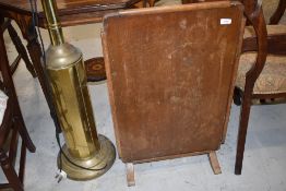 A vintage oak folding firescreen table