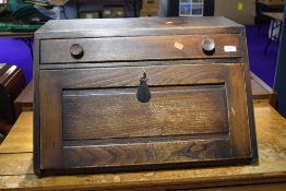 A mid Century dark to mid stain Ercol style table top desk, approx. width 64cm