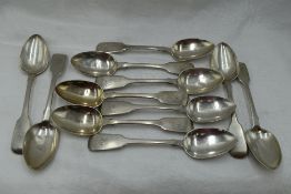 Eleven Georgian silver teaspoons of fiddle back form bearing monogram B to terminals, London 1831,