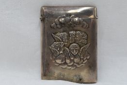 An Edwardian silver card holder of plain form having moulded cherubic decoration to front and hinged