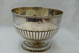 A Victorian silver rose bowl having rub over rim, gadrooned decoration and pedestal foot, London