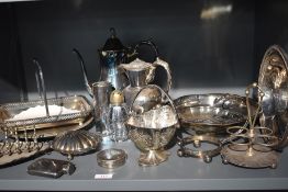 A selection of silver plated ware including tureens, table basket, toast rack, coffee pot etc