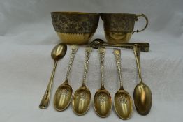 A Victorian silver gilt cream jug, sugar bowl, six coffee spoons and sugar nips all having