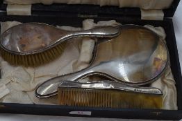 A cased three piece silver dressing table set having reid and dot decoration, Birmingham 1923, W J