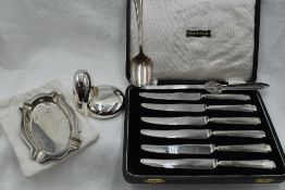 A cased set of HM silver handled butter knives, an HM silver ash tray of oval form, a silver