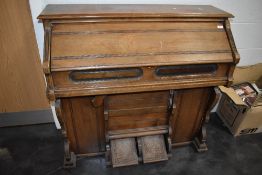 A late stained frame American organ/harmonium of typical chapel design labelled for Mason &
