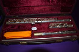 A Buffet Crampon flute , stamped made in England, BC6020, serial number 771283 (cooper scale), in