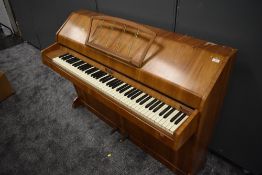 A mid 20th century walnut cased piano by Eavestaff, 'Pianette Mini Piano' six and a half octave