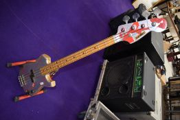 A vintage bass guitar, headstock labelled Satellite