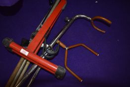 Two vintage guitar stands and a microphone stand