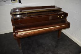 An early 20th Century baby grand piano, 85 key , in mahogany case on square tapered legs, signed