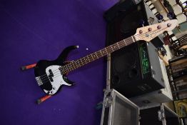 A Peavey Milestone BXP bass guitar , with gig back