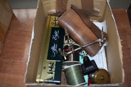 A box of assorted fishing tackle, including vintage brass fly reel and leather pocket fly case