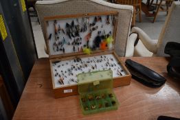 A large selection of fishing flies in double sided wooden box, wallet and small box