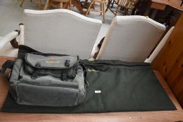 Two Wychwood fishing bags one containing fishing tackle