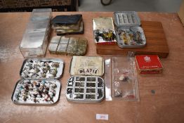 A large selection of fishing flies in boxes, tins and wallet
