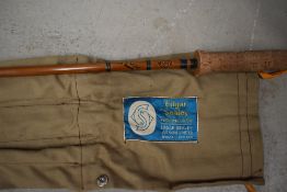 An Edgar Sealey three piece split cane fly rod 9ft 6in long with spare tip in original sleeve