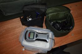 Two Daiwa spinning reels in cases and set of digital fish scales by Rapala