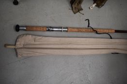 A large 14ft three peice salmon rod unmarked with sleeve