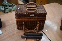 A basket fishing creel with two preists