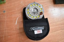 A Pflueger 1912 Fly Reel in original case