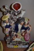 A Staffordshire flat back figure 'The Rival' depicting a scene of three people and a tree.