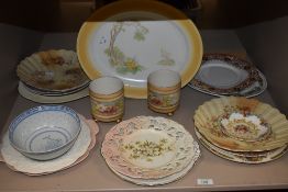 A collection of ceramics including Shelley platter, Royal Devon vases, and various plates.