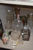 A collection of glass, amongst which are two cut glass decanters and more.