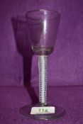 A funnel bowl wine glass on an opaque multi spiral stem surrounding a central solid white stem 16cm