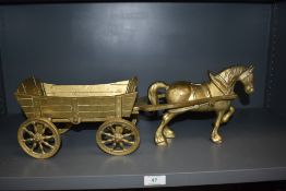 A brass cast model of a horse and cart
