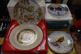 A variety of collectors plates, including those of animal interest, countryside and Christmas