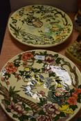 Two deco styled chargers,bearing the name Charlotte Rhead by Crown Ducal having hand painted designs